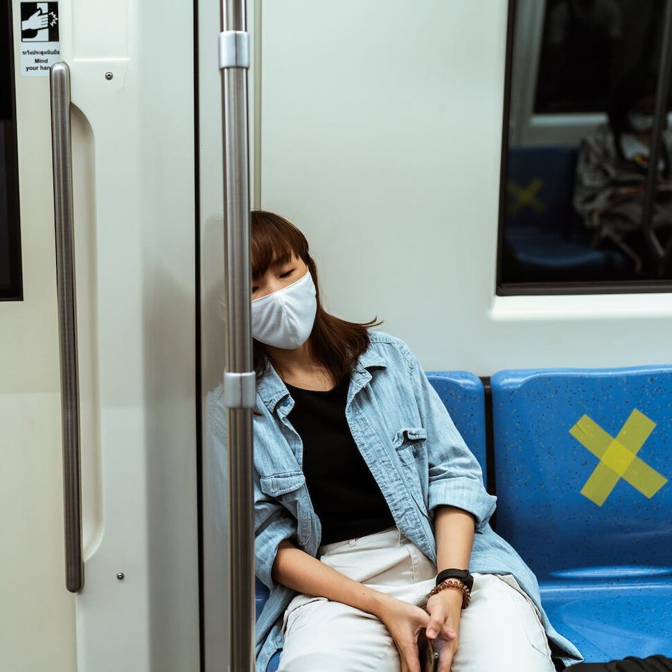 Woman Wearing a Face Mask on the Subway