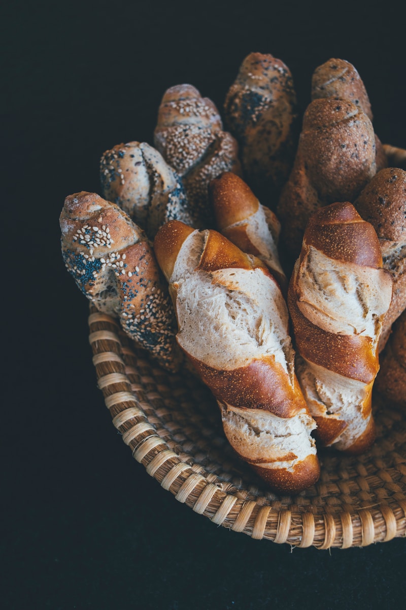 baked bread on brown wicker bowl
